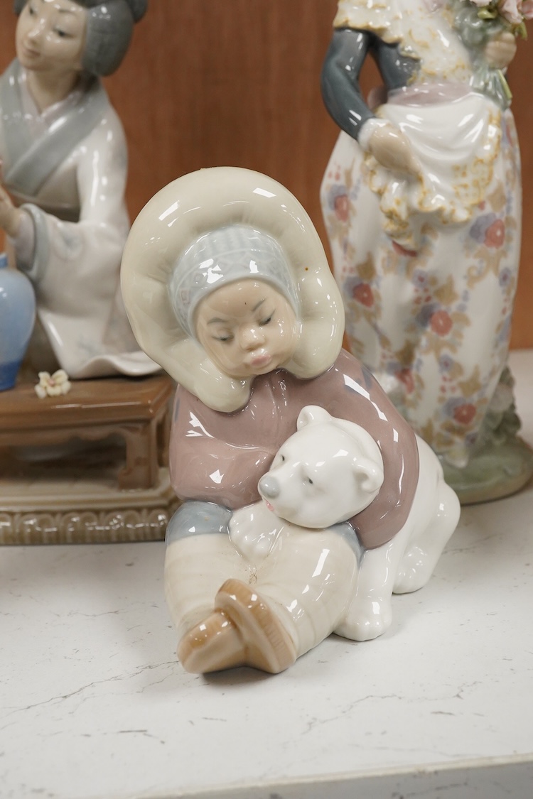 A collection of five Lladro figures, largest 24cm high